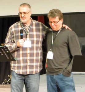 ABMB executive director Daniel Beutler prays for Terry Lamb, who will serve the province in the areas of pastoral care and prayer.