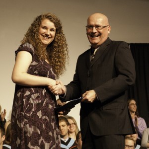 Bethany president Howie Wall congratulates Stephanie Chase, winner of the 2nd-year academic award (for excellence in an exegetical or research paper ) and the Governor General's bronze medal