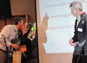 AEFMQ executive secretary Gilles Dextraze embraces Ginette Bastien. The gathering gave a standing ovation as AEFMQ board secretary Robert Dagenais thanked Bastien for her three years as board president.