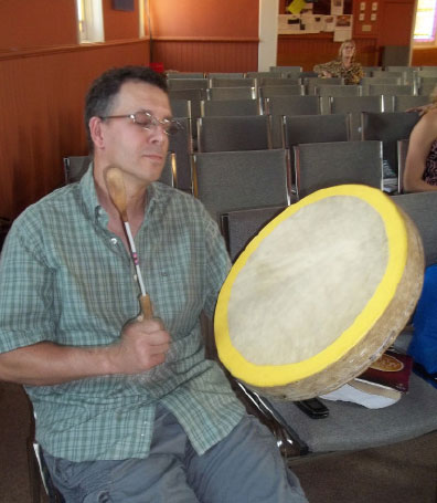 Westview member Ray LaChance plays a  traditional drum in worship. Photo: Stacey Weeks