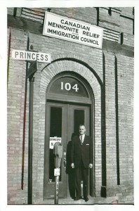 Executive director J.M. Klassen stands outside the first MCC Canada office in a DeFehr warehouse on Princess Street, Winnipeg. 
