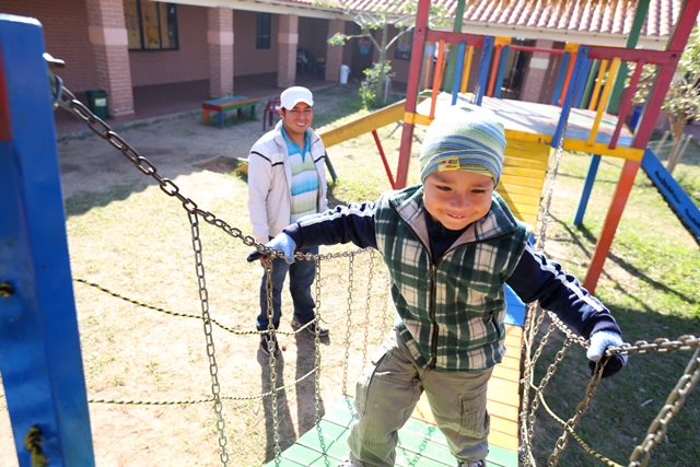 Oscar Yoadel, 4, plays at Guarderia Samuelito, his daycare in Santa Cruz, Bolivia run by the Bolivian Evangelical Mennonite Church, an MCC partner. His father, Oscar Pinto, is a single dad who would not be able to work full-time without the daycare.   MCC photo by Nina Linton