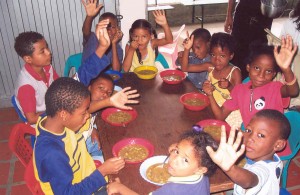 Children in Paraguay eat a meal from the Gleaners.