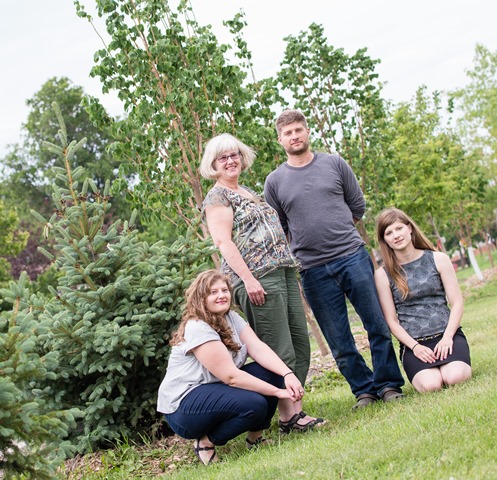 Eric Schmidt's family (from left) daughter Amanda, wife Anne, son Alex, and daughter Jessica, (missing: Matthew) with memorial tree. 