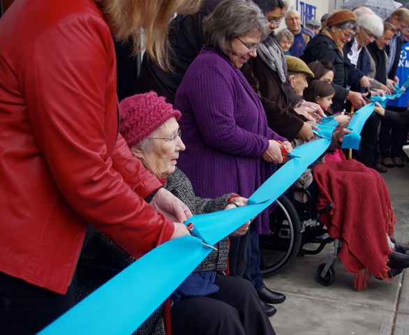 Thirteen people, representing different ages and departments of MCC, cut the ribbon during the official opening of the new Abbotsford building – held outdoors in the rain on Dec. 6. Among the ribbon cutters was long-time MCC B.C. board chair Siegfried Bartel, who turns 100 in January 2015.
