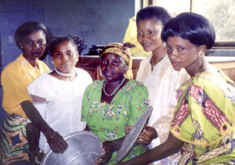 Several women from DR Congo (far left)display their handmade aluminum pots. Photos: David Wiebe