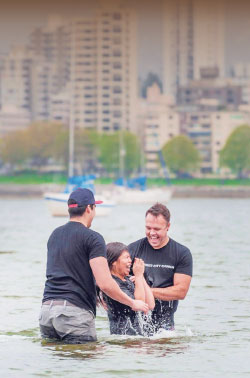 Christ City pastor Brett Landry baptizes a new  believer at Kits Beach in Vancouver. Photos: courtesy C2C Network