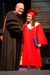 Joy Norris receives her diploma from president Bryan Born. 