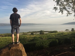 An MBCI student surveys the Sea of Galilee.