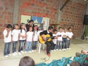 Participants of Education Brings Hope perform a song at their graduation. The El Progreso neighborhood still has no water or sewer and faces regular gang violence. Education Brings Hope is a Global Family program that provides salaries, food and teaching supplies for a preschool and primary school of the Colombian Mennonite Brethren Church. Credit: Colombian Mennonite Brethren Church