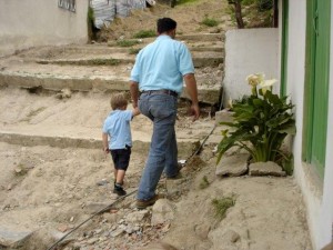 David Bonilla, founder of the Education Brings Hope Children’s Centre, walks with Isaac Friesen during his family’s visit to the a Global Family project in Cazucá, Colombia. Credit: Cynthia Friesen