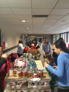 Northview volunteers fill Starfish backpacks with weekend food staples for hungry families. 